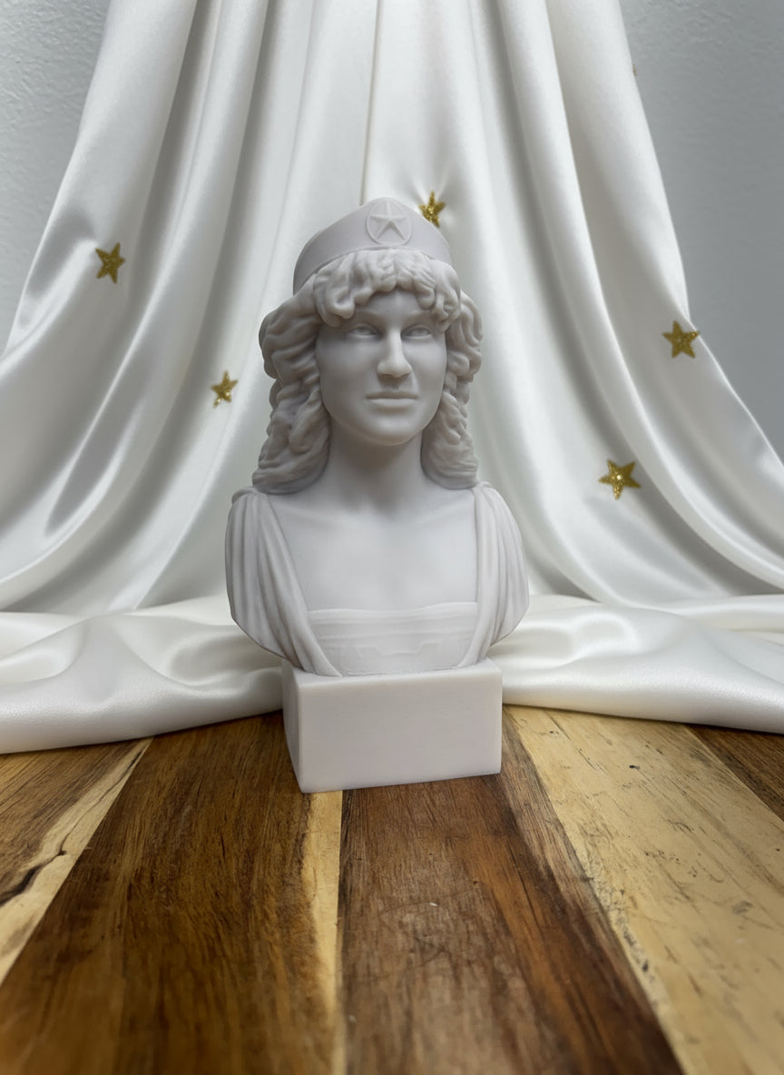 White marble bust on a wooden pedestal against a white wall