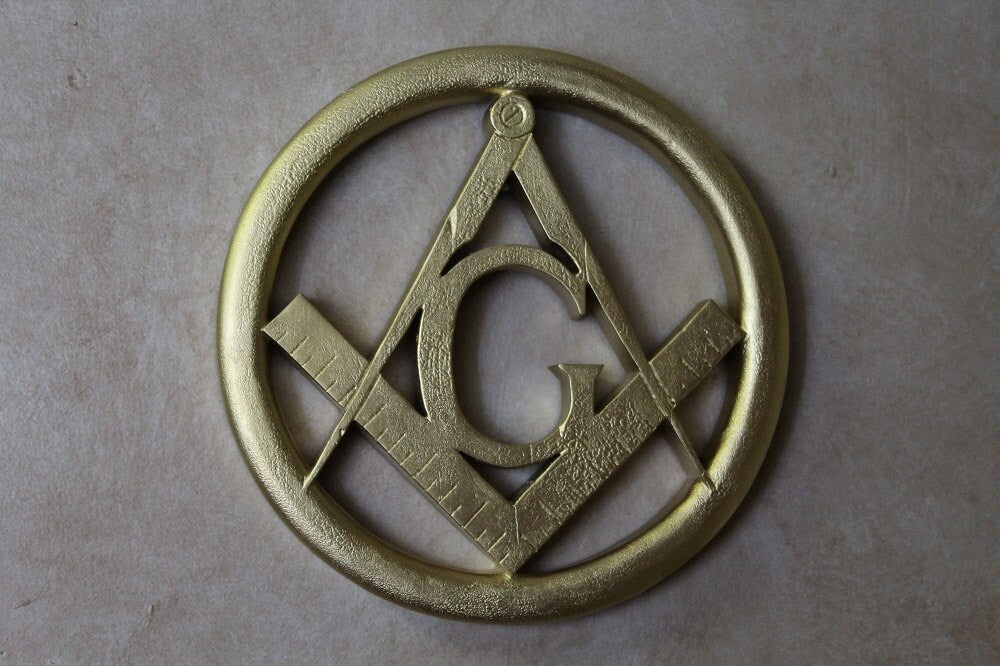 Bonded Marble statue of a Masonic Square and Compass Wall Relief